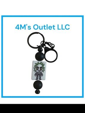 Source Unknown Black and White Character Keychain with Green Accent